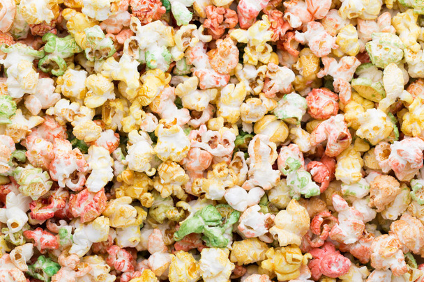 Colored Popcorn texture background. Sweet popcorn. - Zdjęcie, obraz
