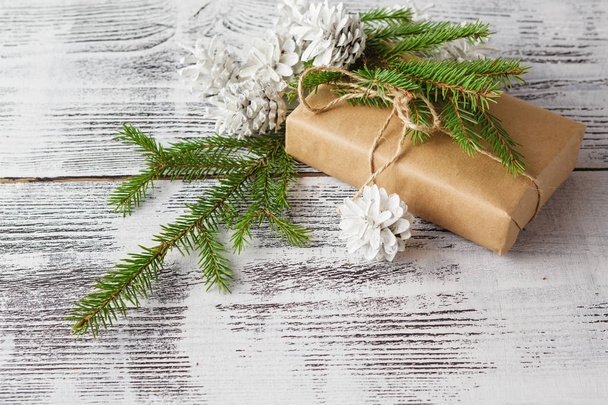 Wrapping eco Christmas packages with brown paper, string and nat - Photo, Image