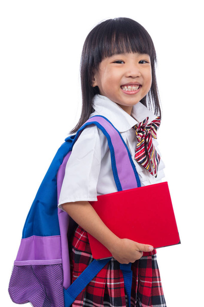 Szczęśliwy azjatycki chiński mała dziewczynka z tornister i książki - Zdjęcie, obraz