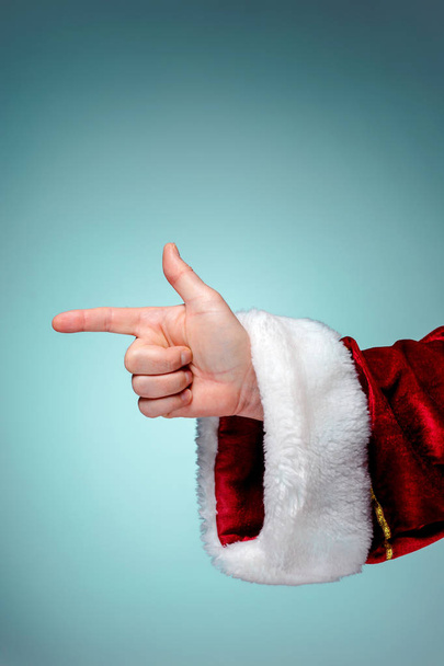 Photo of Santa Claus hand in pointing gesture - Fotoğraf, Görsel