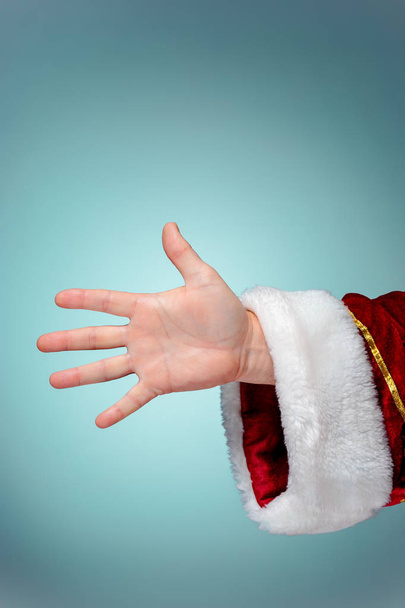 Photo of Santa Claus hand in pointing gesture - Foto, Bild
