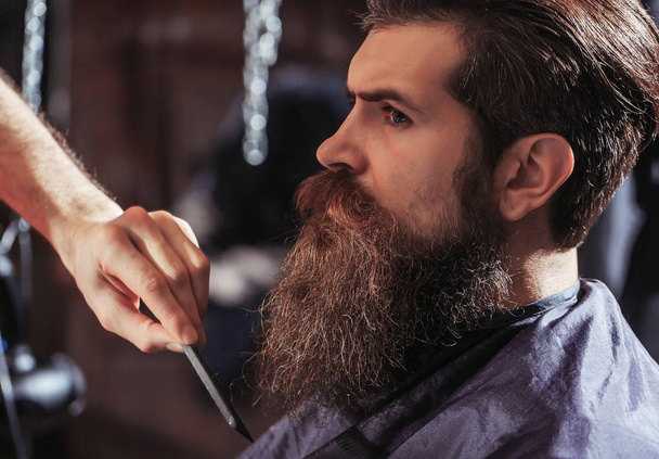Handsome bearded man in barbershop - Фото, зображення