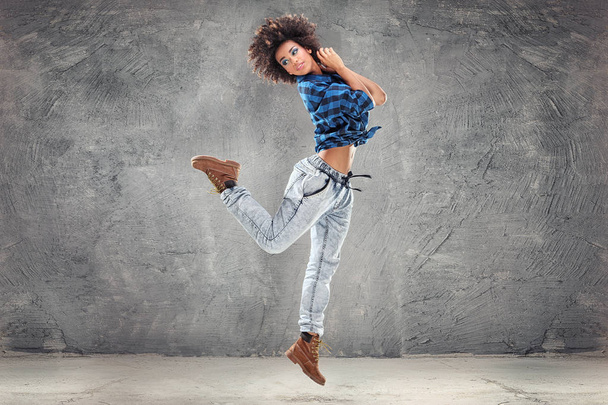 Young girl dancing, jumping. - Фото, изображение