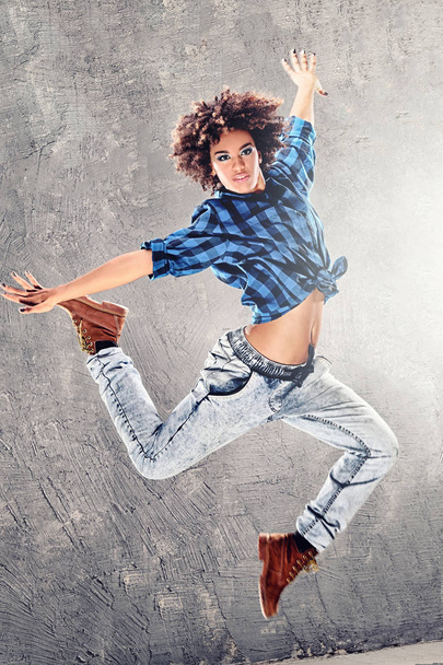 Young girl dancing, jumping. - Fotó, kép