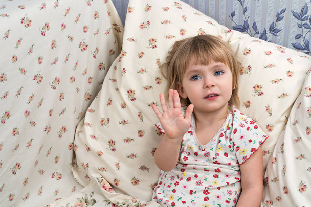 Portrait of a child sitting in bed - Photo, image