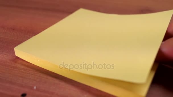 a Hand Tearing Off a Sheet of Paper. - Footage, Video
