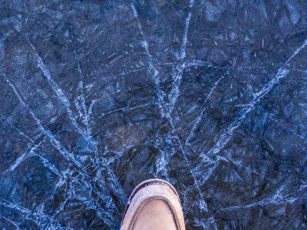 Step on the ice with your feet - Photo, Image