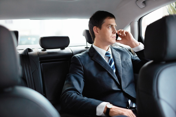 Businessman in a car - Photo, Image