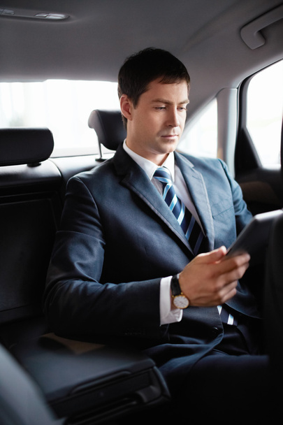 Businessman in a car - Фото, зображення