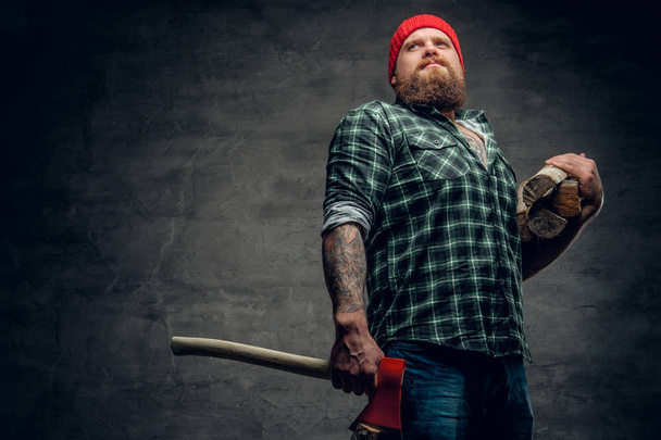 Bearded lumberjack holding an ax
 - Photo, image