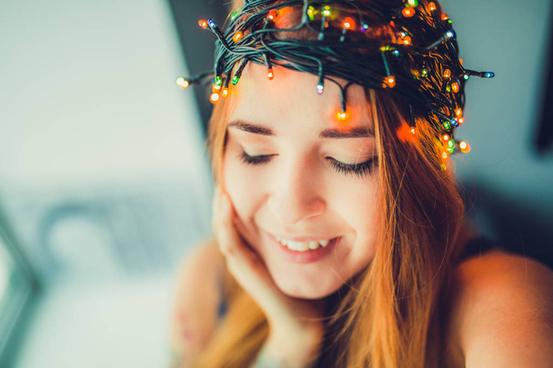 Girl in garland head wreath - Fotoğraf, Görsel