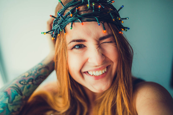 Girl in garland head wreath - Foto, imagen