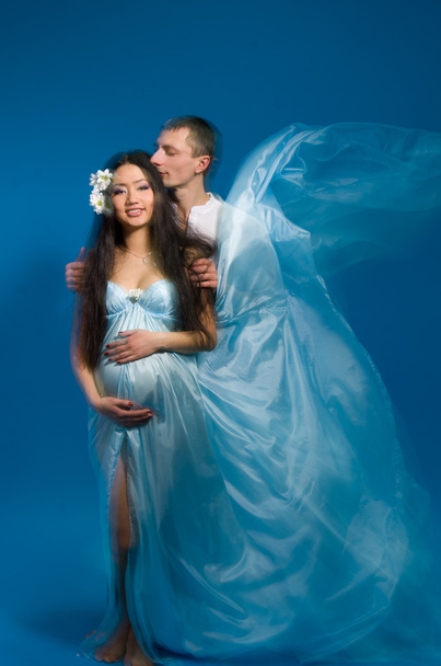 Asian pregnant woman in a silk dress - Photo, Image