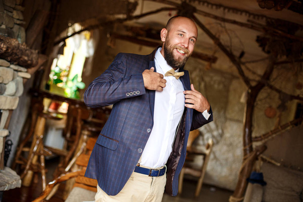 bearded man dressed in a blue jacket at the wedding - Photo, Image
