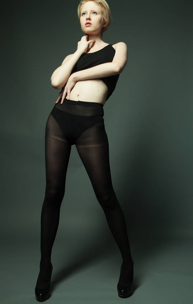 Young fashion model posing in studio - Fotografie, Obrázek