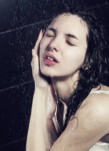 cute curly girl taking a shower - 写真・画像