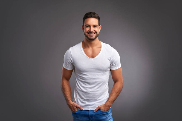 Confident young man smiling	 - Foto, afbeelding