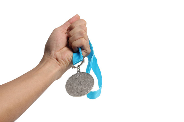  Hand met winnaar medaille - Foto, afbeelding