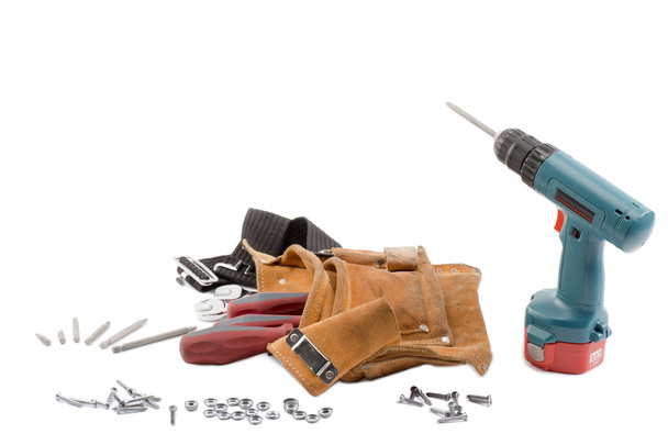 Vista de una correa de herramientas y perforadora
 - Foto, imagen