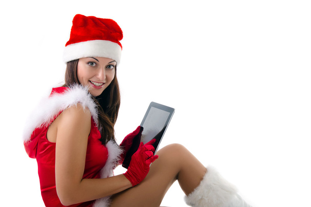 Santa helper meisje met tablet pc - Foto, afbeelding
