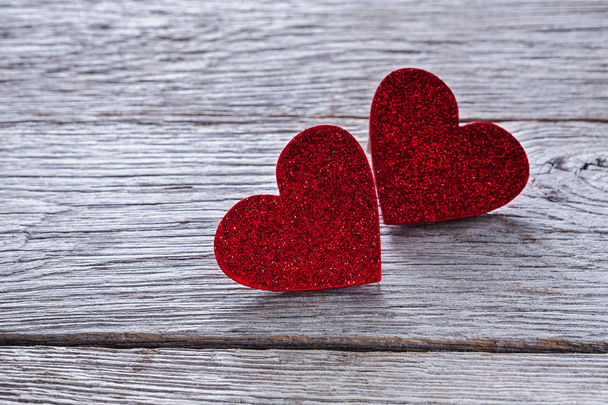 Valentine day background, handmade hearts on wood with copy space - 写真・画像