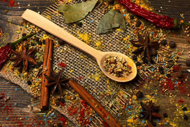 spicy fragrant spices in spoon - Фото, зображення