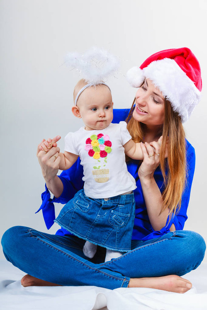 Christmas woman with cute baby. - Foto, Imagem