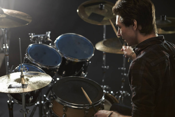 Drummer Playing Drum Kit In Studio - Foto, Imagen