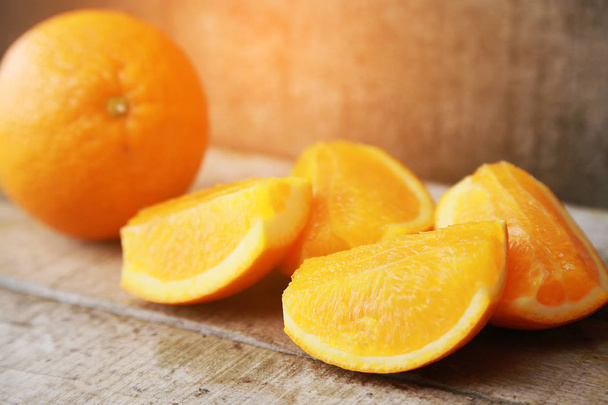 Fresh orange on wooden background for healthy. Organic or clean fruit from orchard in the market. Clean fruit and drink for healthy and diet. Low sugar fruit for diet and feeling fresh when drinking. - Foto, Imagen