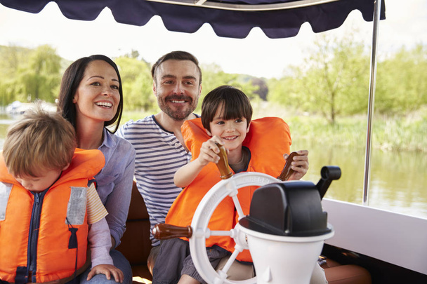 Family Enjoying Day Out In Boat  - Foto, Imagem