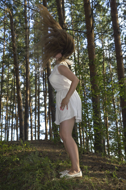 white women make fly hair in forest - Φωτογραφία, εικόνα