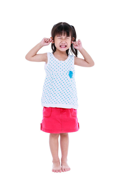 Full body of child putting finger on her ears. Isolated on white background. - Photo, Image