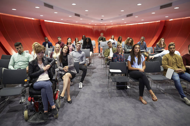 Students sitting facing camera in a classroom - Фото, изображение