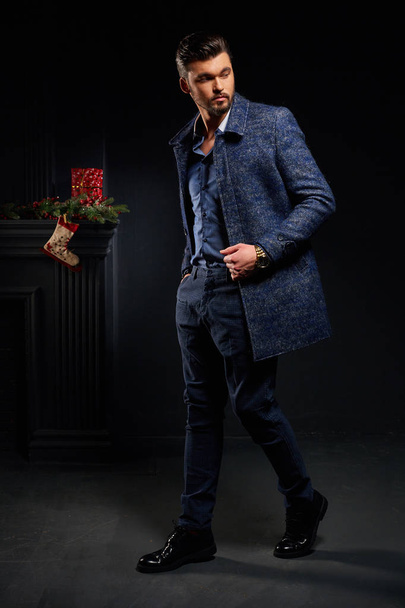 Attractive stylish model male in dark studio - Photo, Image