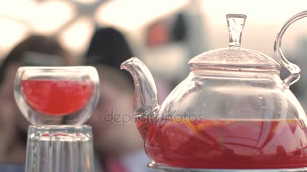 Red hot tea in a cup and teapot - Séquence, vidéo