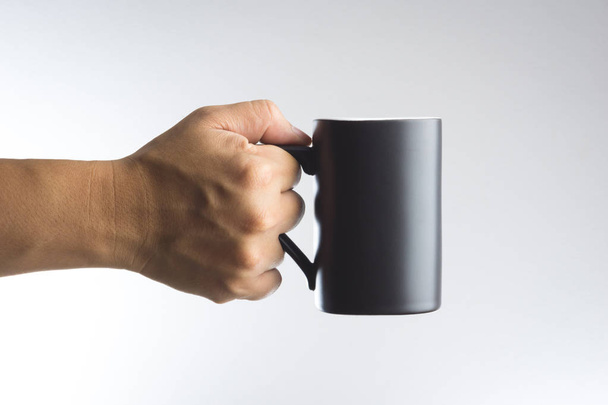 Hand hold dark cup of drink - Fotografie, Obrázek