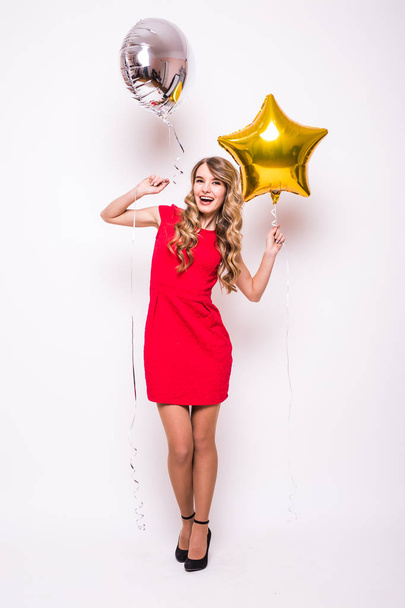  young woman with gold and silver balloon smiling  isolated on white - Foto, afbeelding