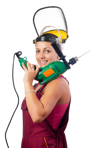 Beautiful smiling female construction worker with drilling machine isolated on white - Photo, Image
