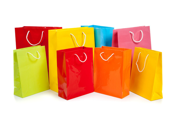 Assorted colored shopping bags on white - Photo, image