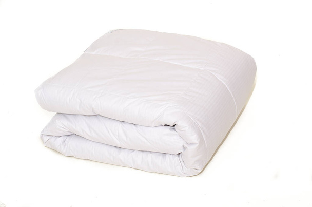 Rolled white duvet cover on white isolated background - Photo, Image