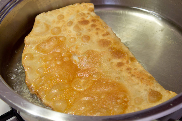 Cheburek fried on a pan - Photo, Image
