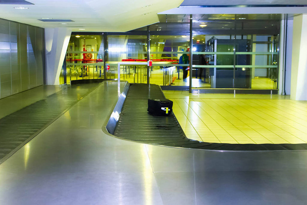 The modern airport carousel with a suitcase - Photo, Image