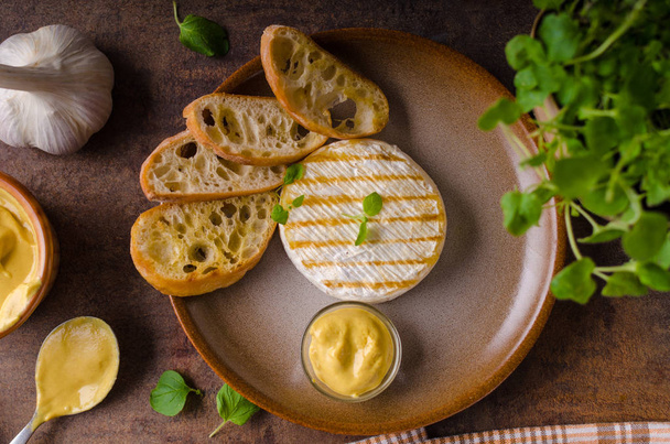 Grilled camembert with dijon mustard - 写真・画像