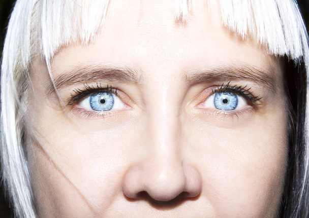 Beautiful insightful look women's blue eyes - 写真・画像