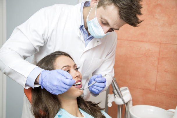Patient having dental checkup - Foto, imagen