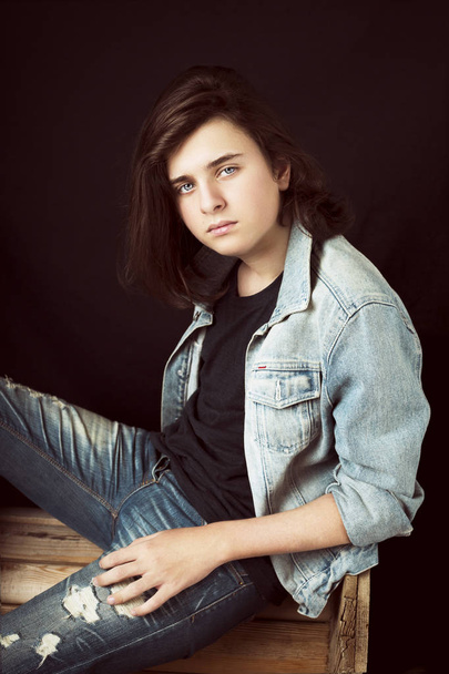 Fashion portrait of a teenager wearing jeans jacket.Monochrome - 写真・画像
