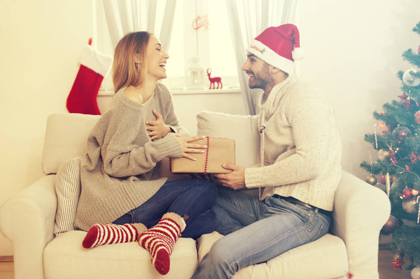 Couple in love with Christmas present - Zdjęcie, obraz