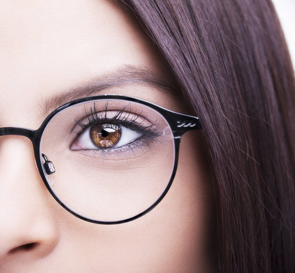 Beautiful young woman wearing glasses. Close-up shot - Zdjęcie, obraz
