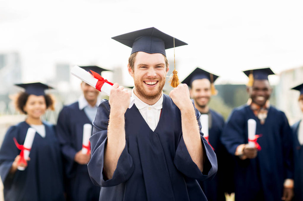 happy student with diploma celebrating graduation - Zdjęcie, obraz