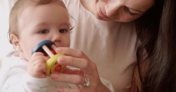 Mother And Baby Playing With Colorful Toy - Кадры, видео